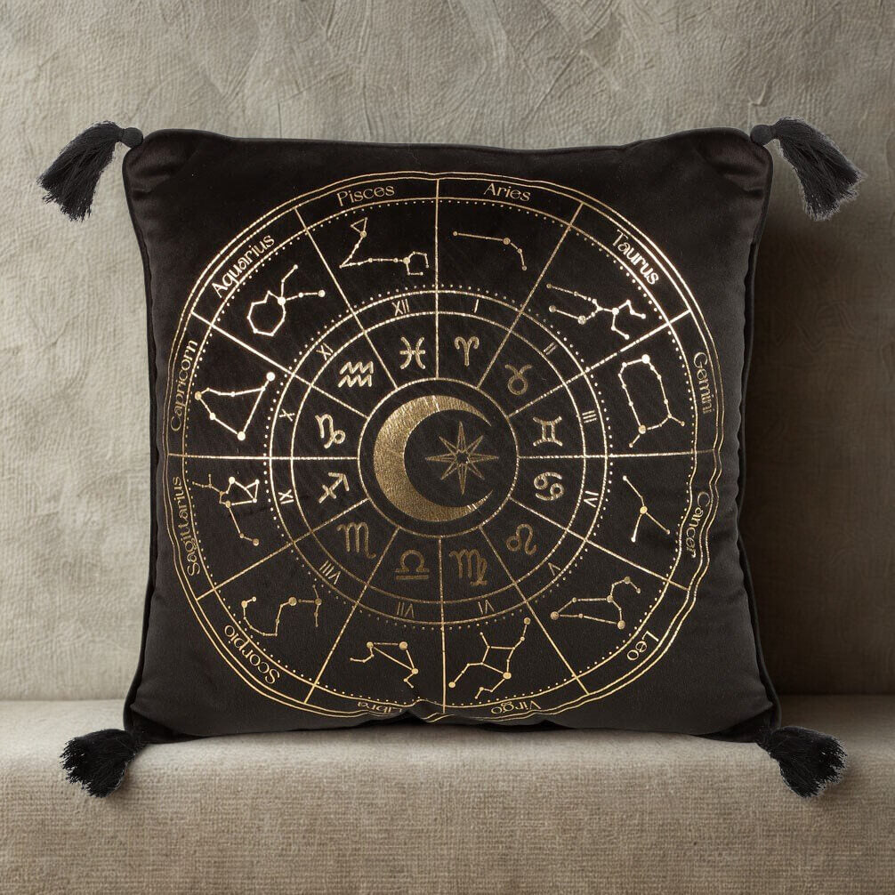 Decorative pillow with zodiac design on a neutral background